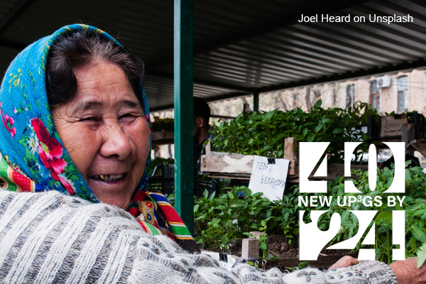 photo of woman wearing headscarf in market by Joel Heard on Unsplash