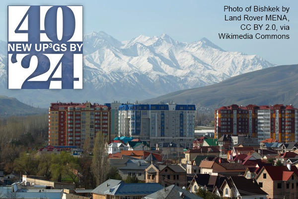 view of Bishkek with snowcapped mountains in distance by Land Rover MENA. CC BY 2.0 via Wikimedia Commons.