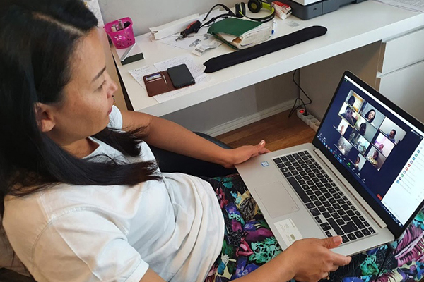 woman on a laptop at an online meeting