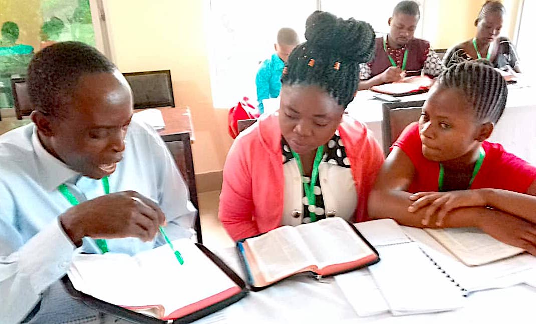 family studying the Bible together